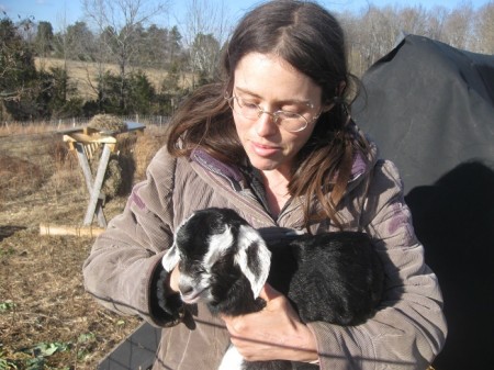 Rejoice is pictured here with a baby goat named Sweet Chocolate.